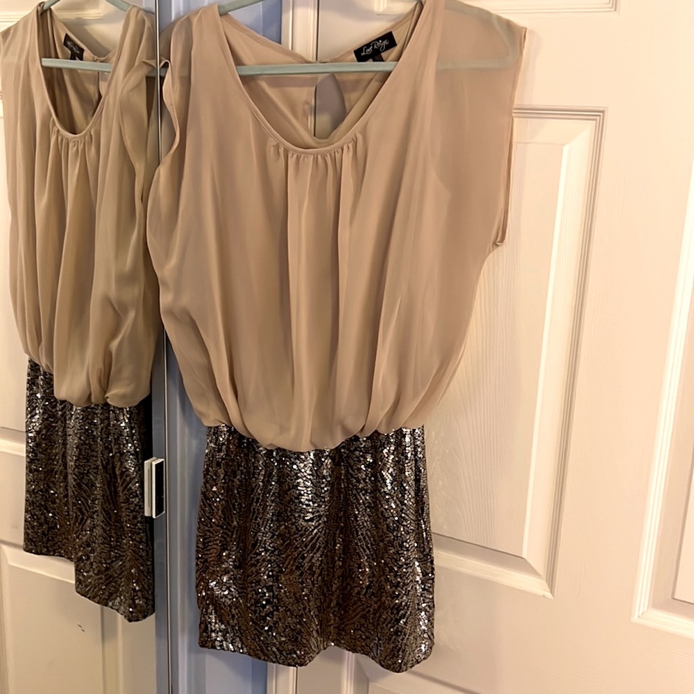 This mini dress is modest on top, party in the bottom. Size L